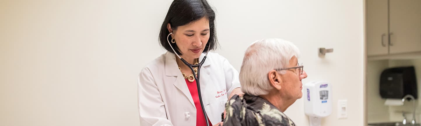 Helen Te, MD, with a patient