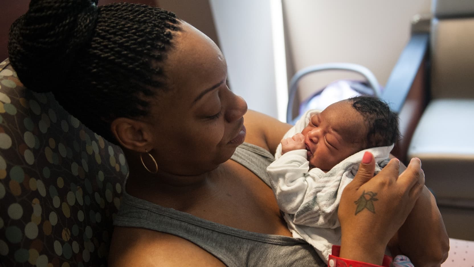 woman holding newborn baby
