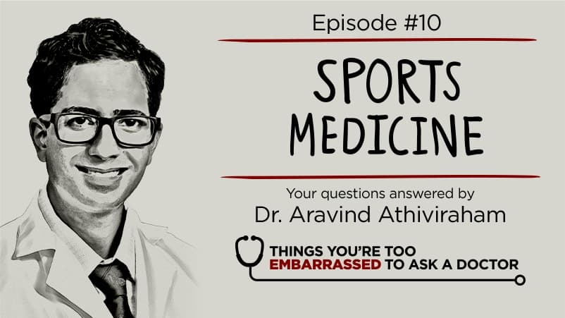 Doctor sitting on cabinet looking right, looking happy