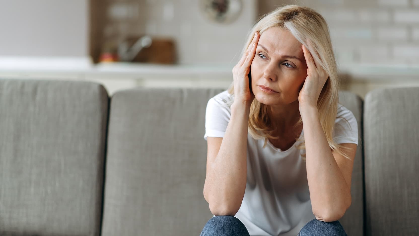 fatigued woman on couch