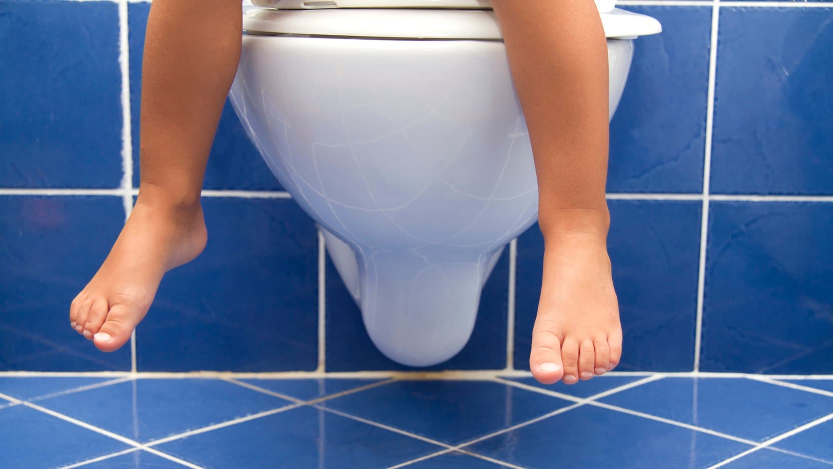 childs feet in bathroom