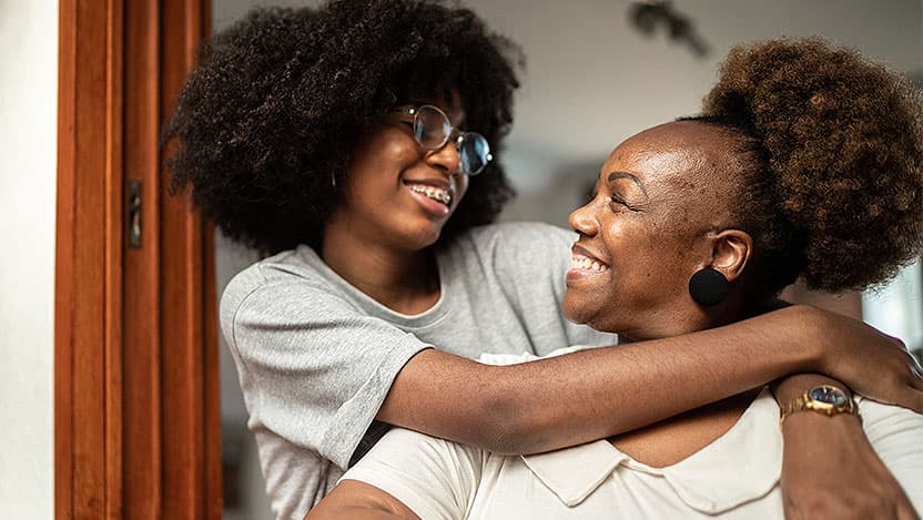 Teen hugs mom
