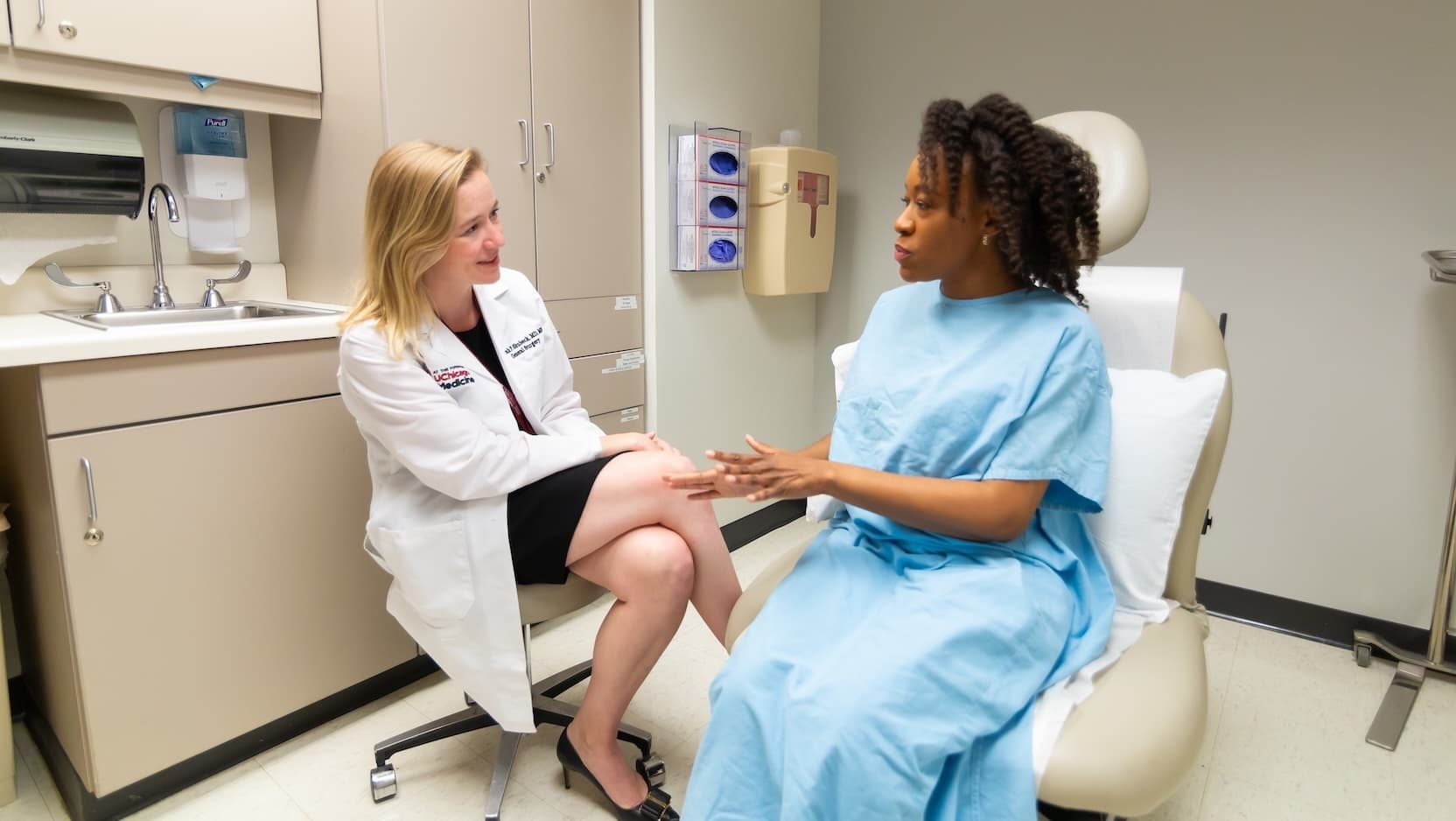 Sarah Shubeck, MD, MS, consults with a patient.