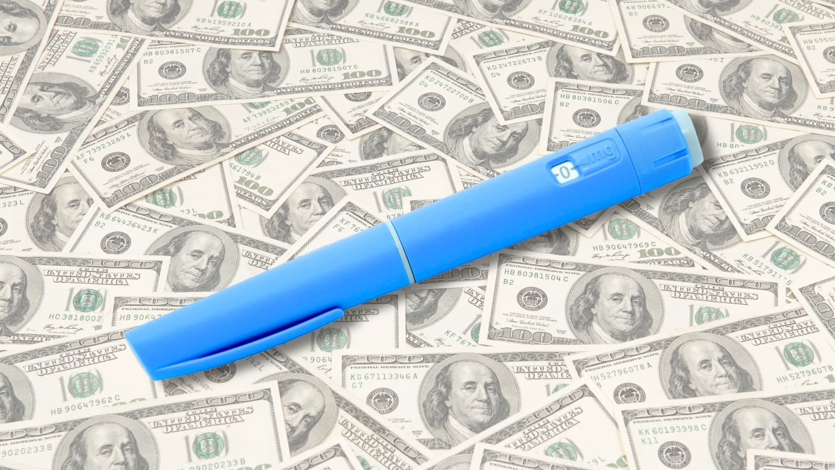 A blue single-use pen for patient self-injection of GLP-1 receptor agonist drugs, shown on a background of scattered hundred-dollar bills