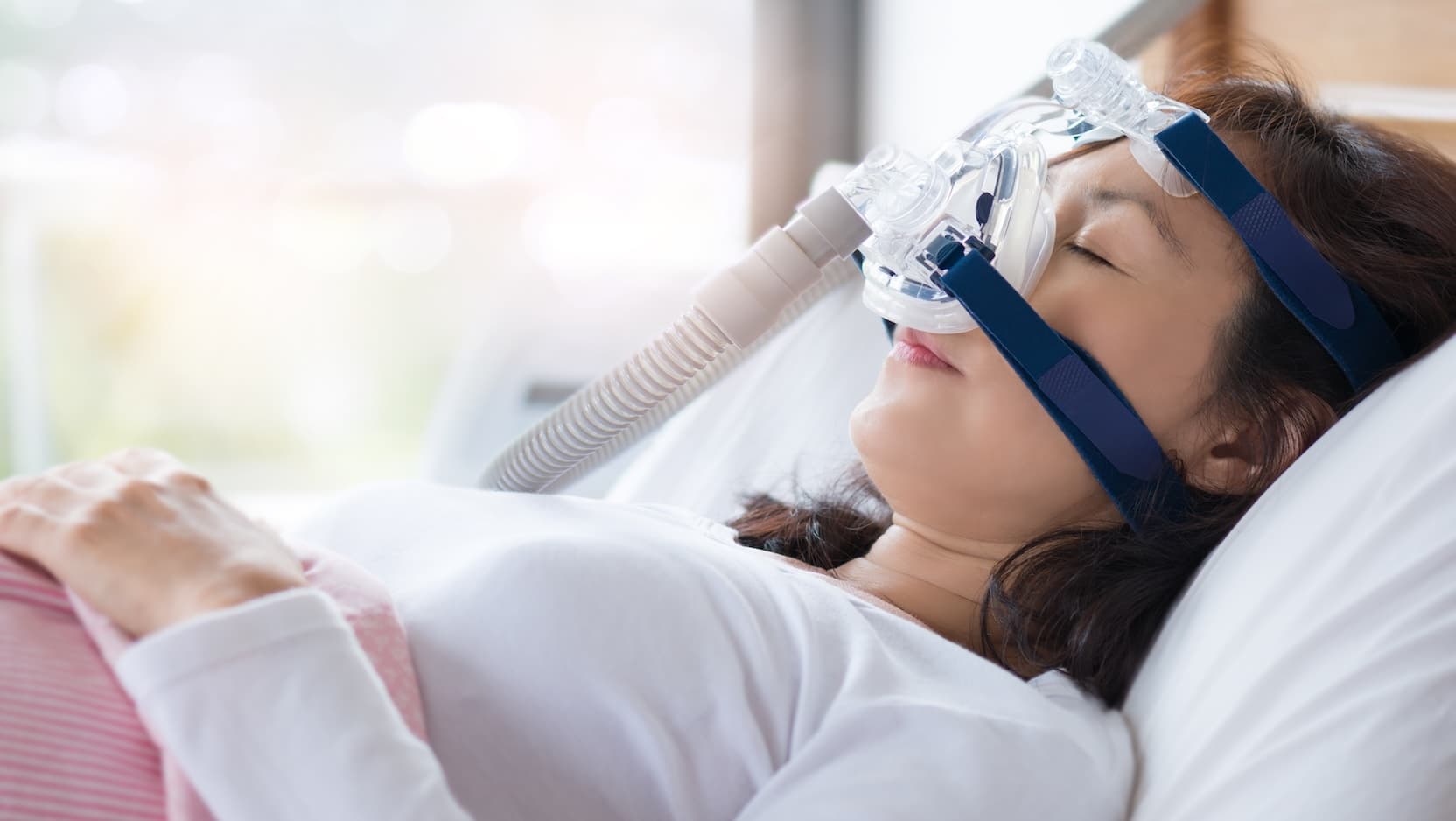 woman on bed in hospital