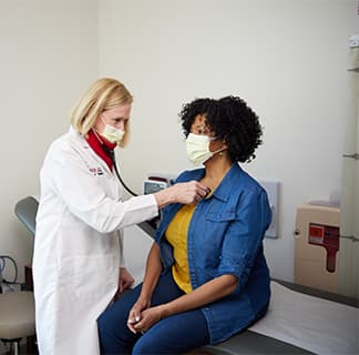 Kathleen Drinan examines patient