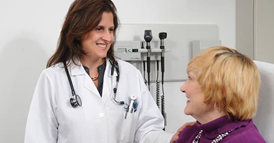 Image of Dr. Pannain working with a patient