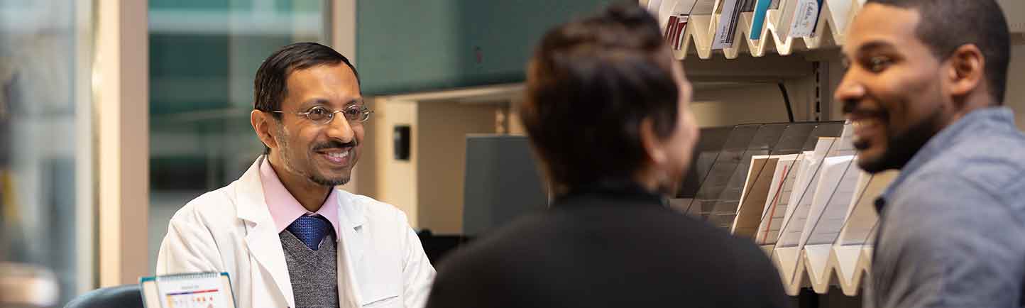 Reproductive endocrinologist Dr. A. Musa Zamah consults with a couple